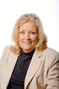 Councillor Gwenn Lunn a middle aged woman wearing a cream blazer, black blouse with blonde hair smiling